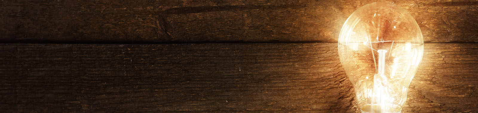 Lightbulb image for new ideas and knowledge on a dark background
